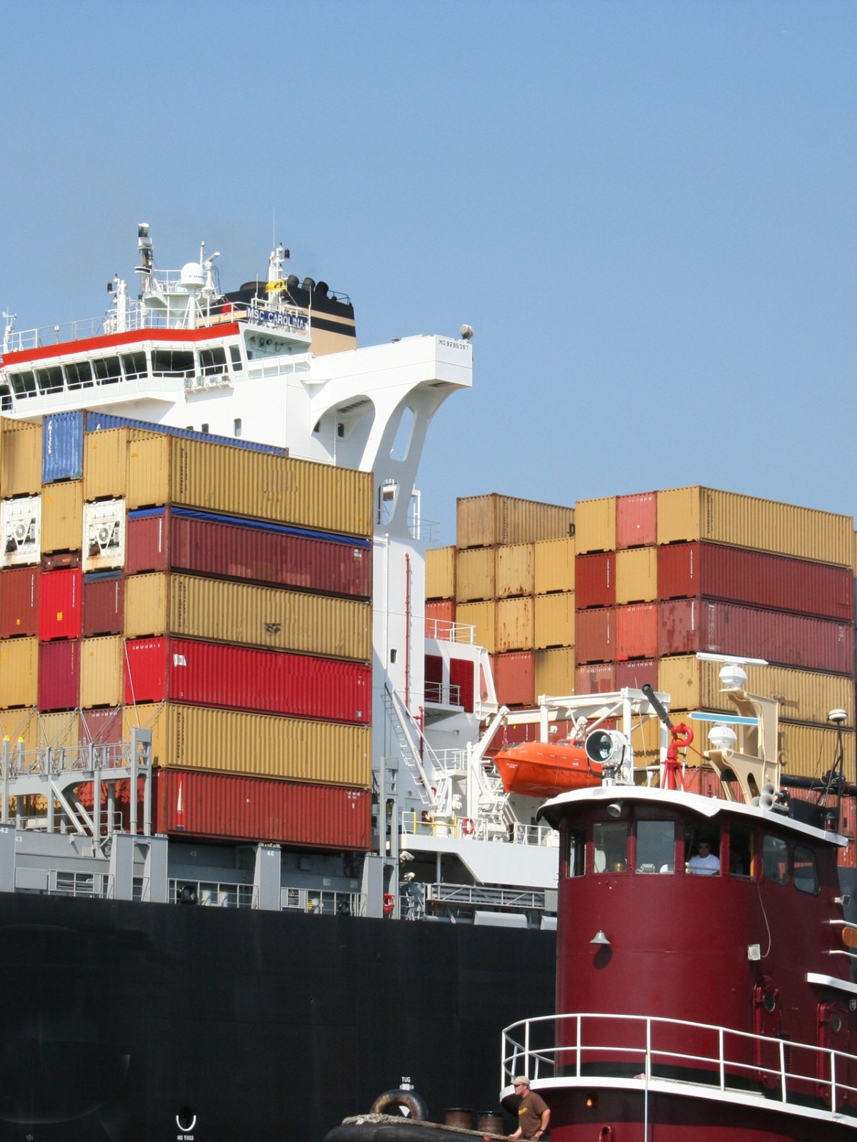 a large ship stacked with shipping containers