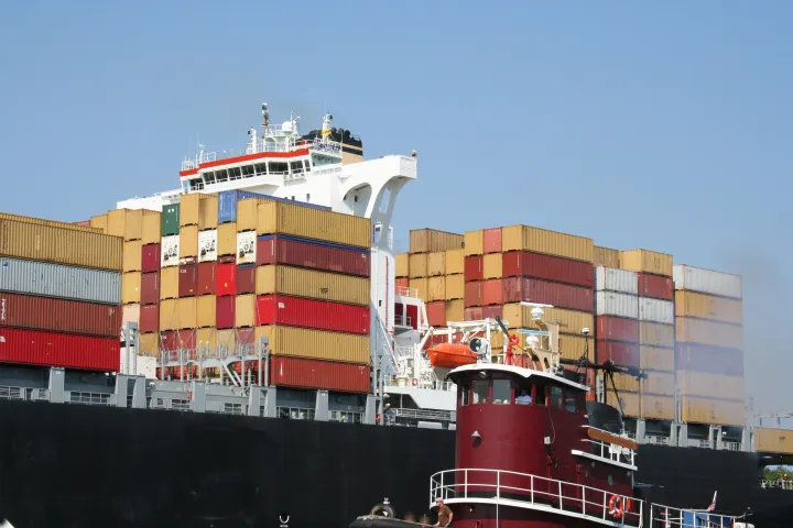 a large ship stacked with shipping containers